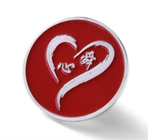 Lacquered badge